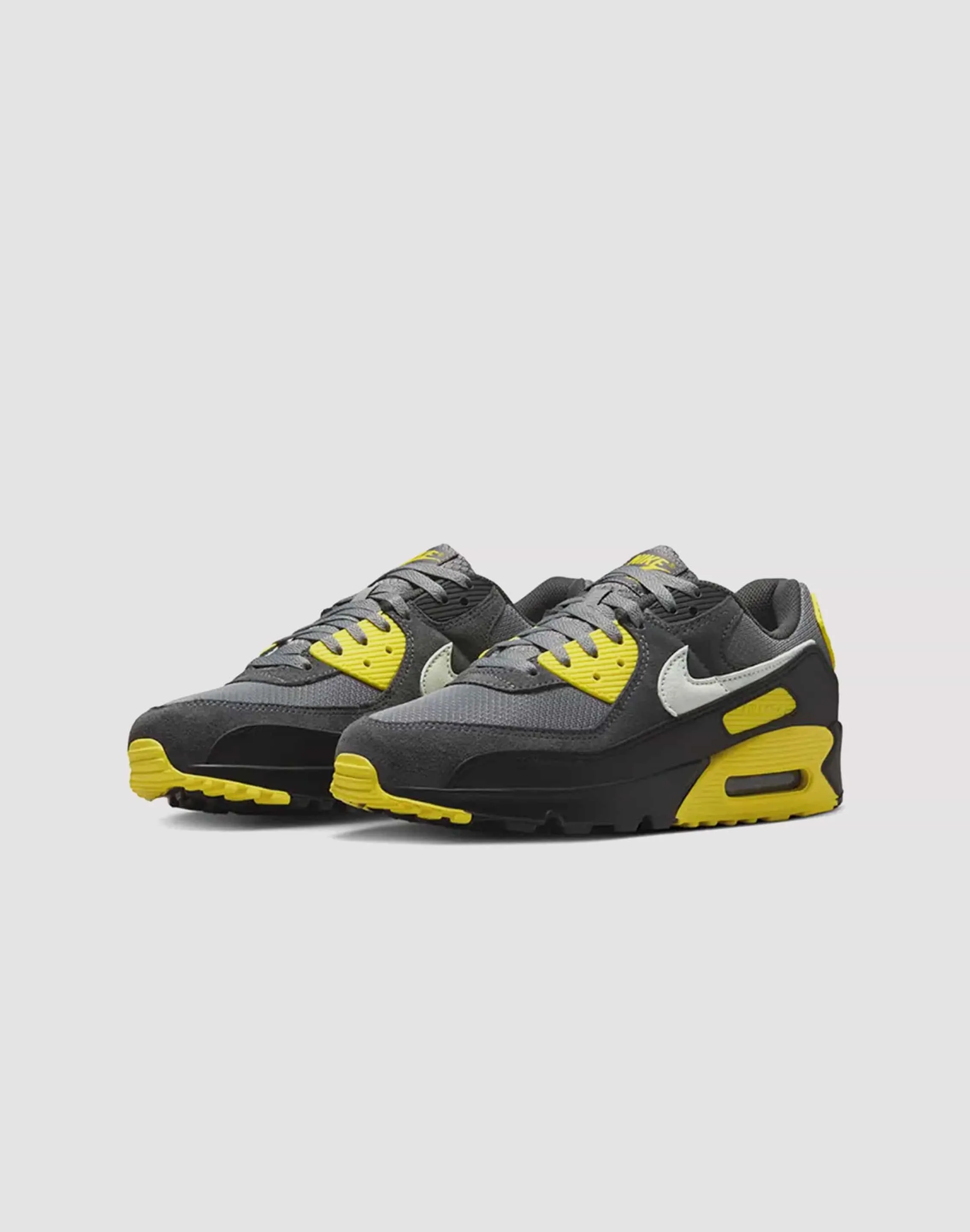 running in a tennis court area shoes Nike Air Max 90
