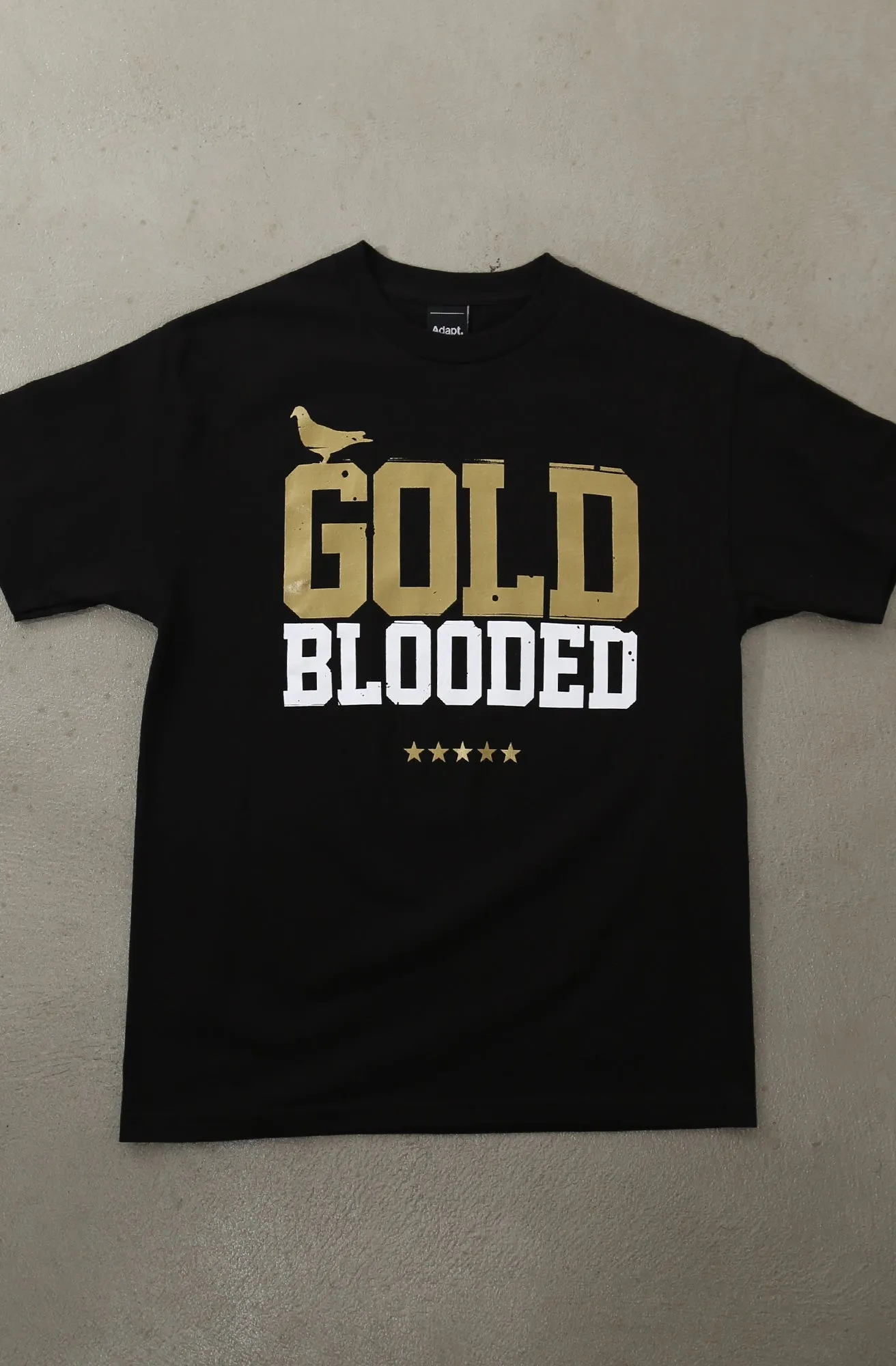 Non Restrictive Silhouette Gold Blooded (Men's Black/White/Gold Tee)