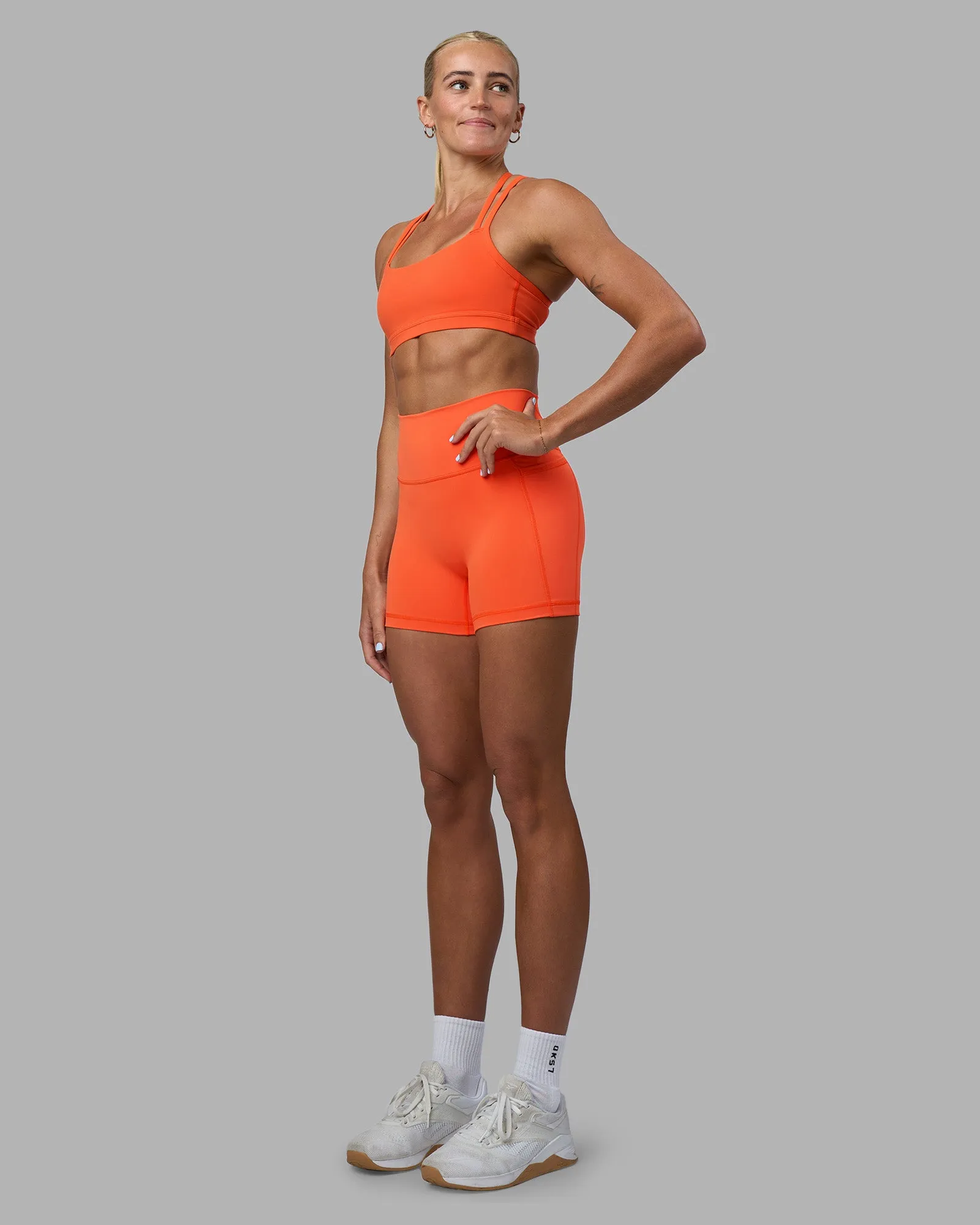 Velocity Sports Bra - Ultra Orange Smooth Structure Pilates practitioners